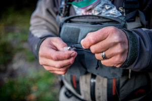 Tying on a fishing fly